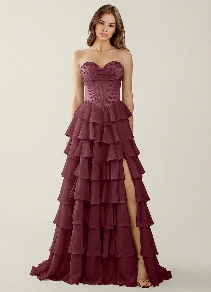 SHERY strapless ruffle maxi dress with a corset design, back tie, waist-cinching fit, and slit