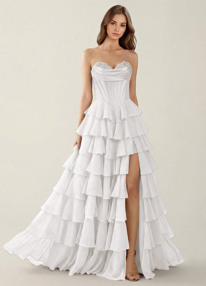 SHERY strapless ruffle maxi dress with a corset design, back tie, waist-cinching fit, and slit