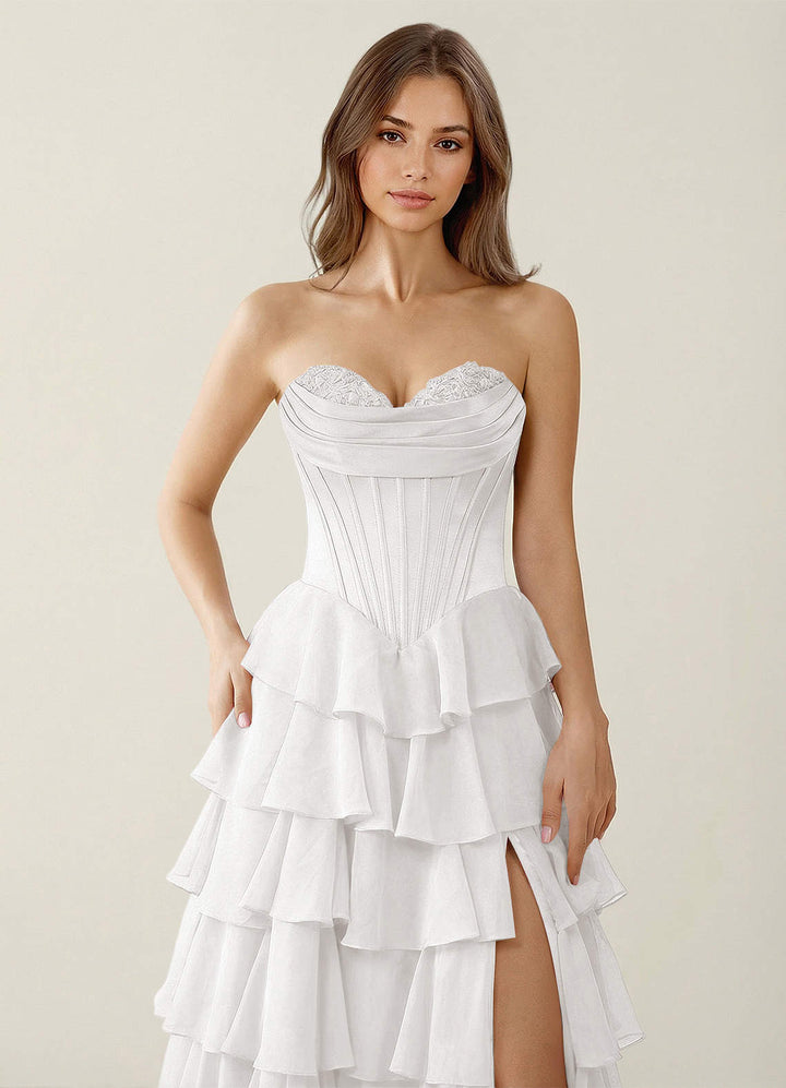 SHERY strapless ruffle maxi dress with a corset design, back tie, waist-cinching fit, and slit