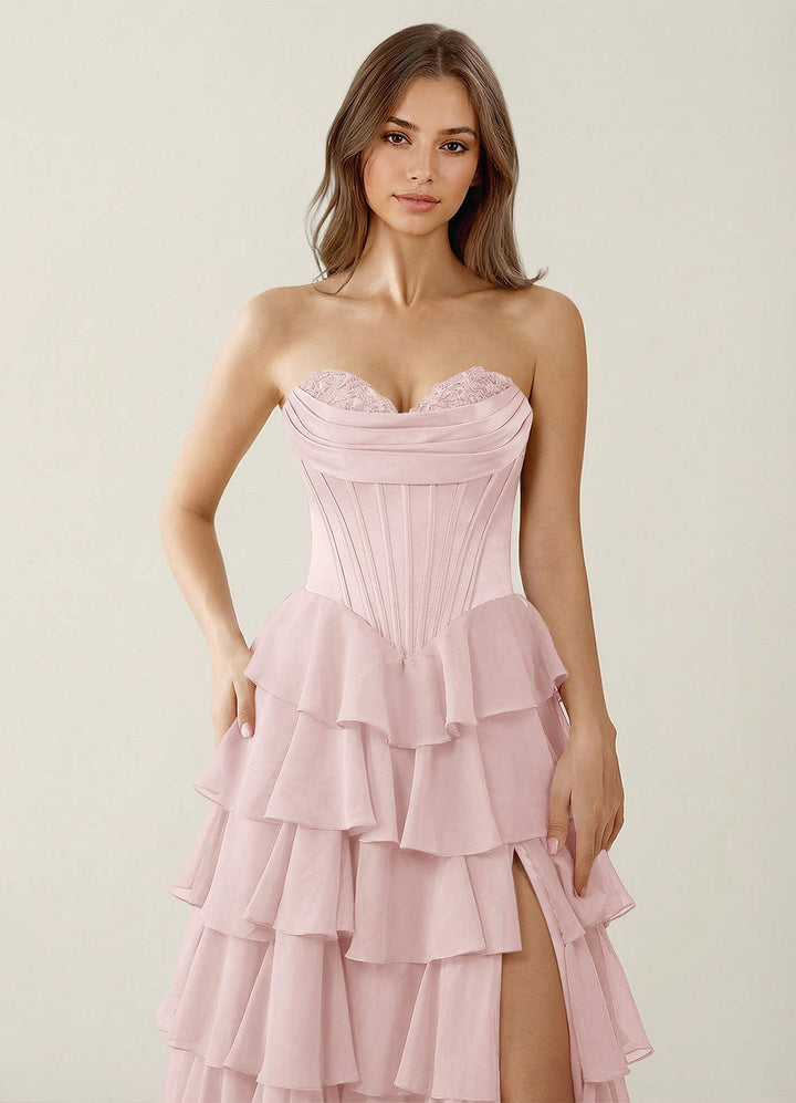 SHERY strapless ruffle maxi dress with a corset design, back tie, waist-cinching fit, and slit