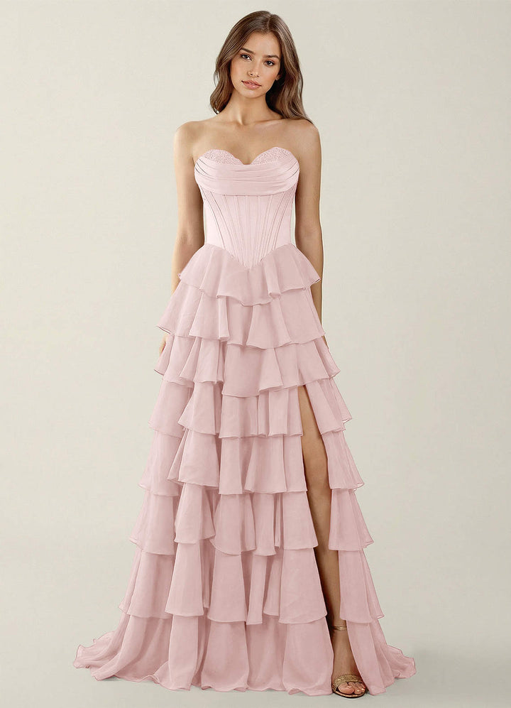 SHERY strapless ruffle maxi dress with a corset design, back tie, waist-cinching fit, and slit