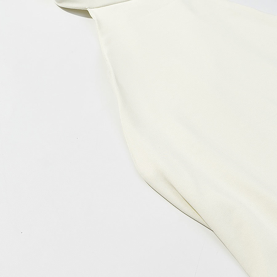 Tiered balloon mini dress with a turtleneck, neck ties, and an open back – DASSY