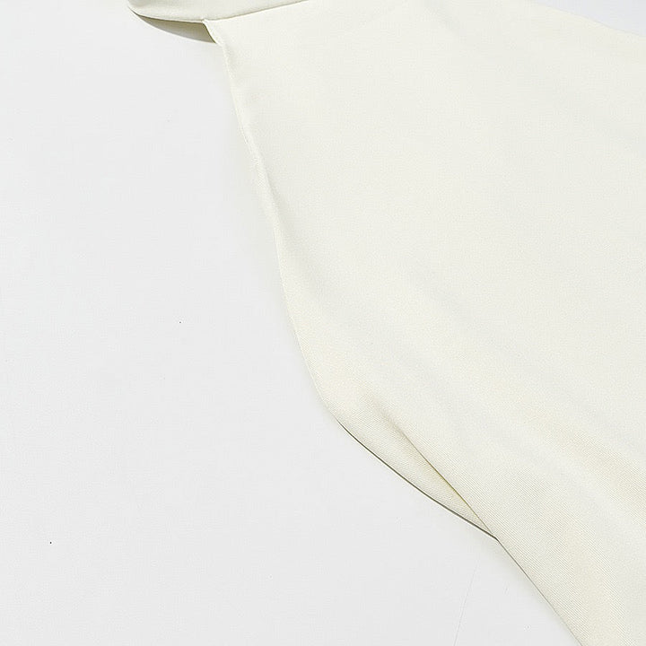 Tiered balloon mini dress with a turtleneck, neck ties, and an open back – DASSY