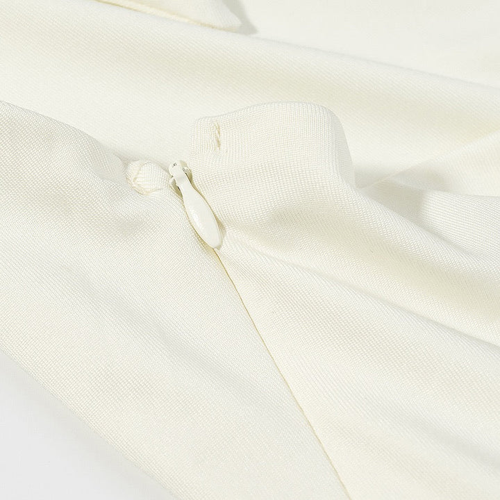 Tiered balloon mini dress with a turtleneck, neck ties, and an open back – DASSY