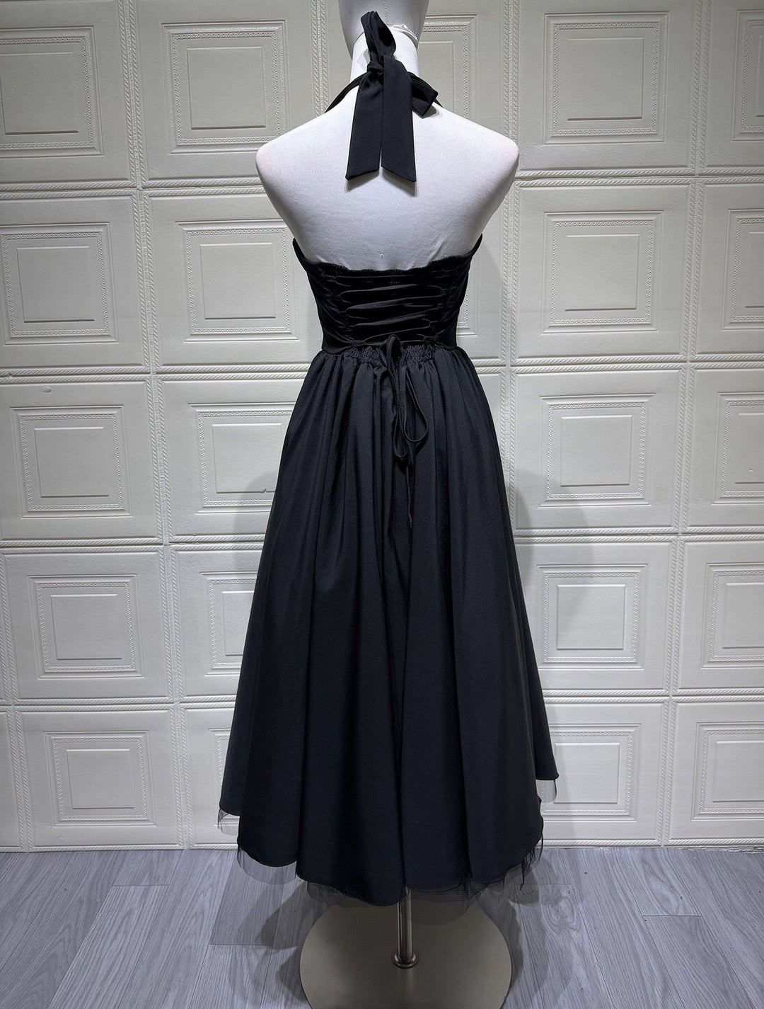 Marlene midi dress with a neck tie, open back, and tulle trim