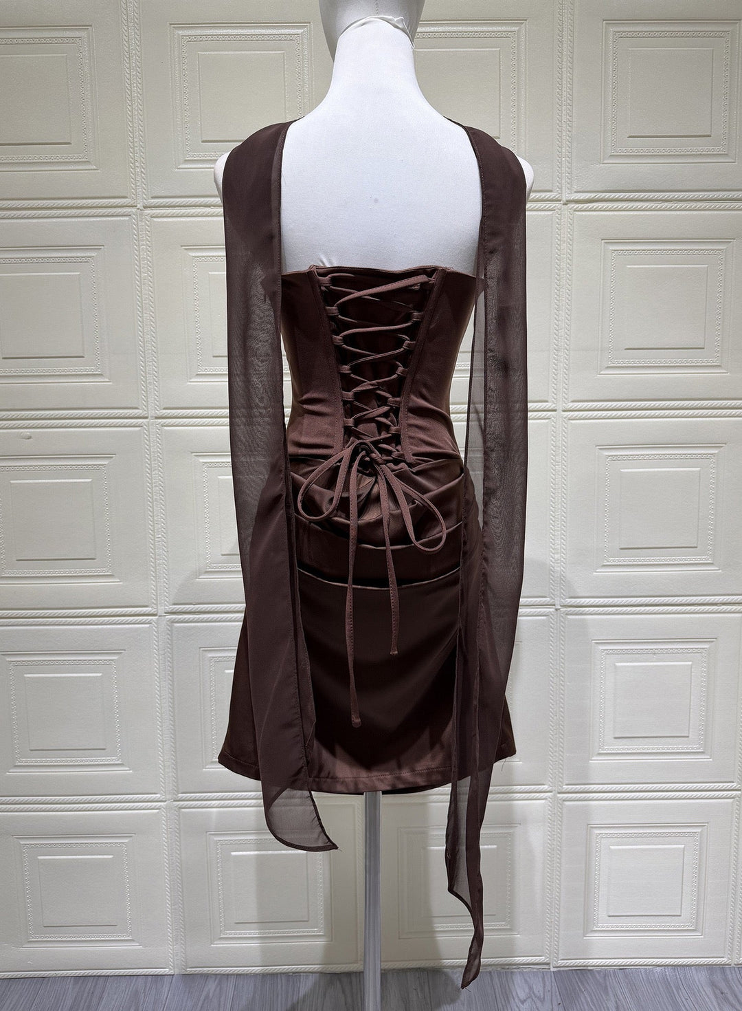 GENNA strapless satin mini dress with pleats, a tie-up corset at the back for a fitted waist, and a scarf detail