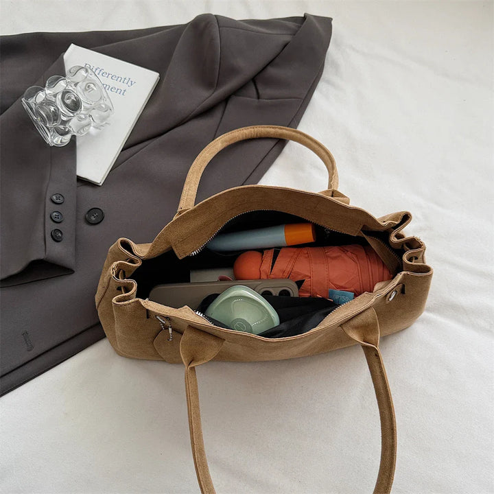 Suede bag with retro design
