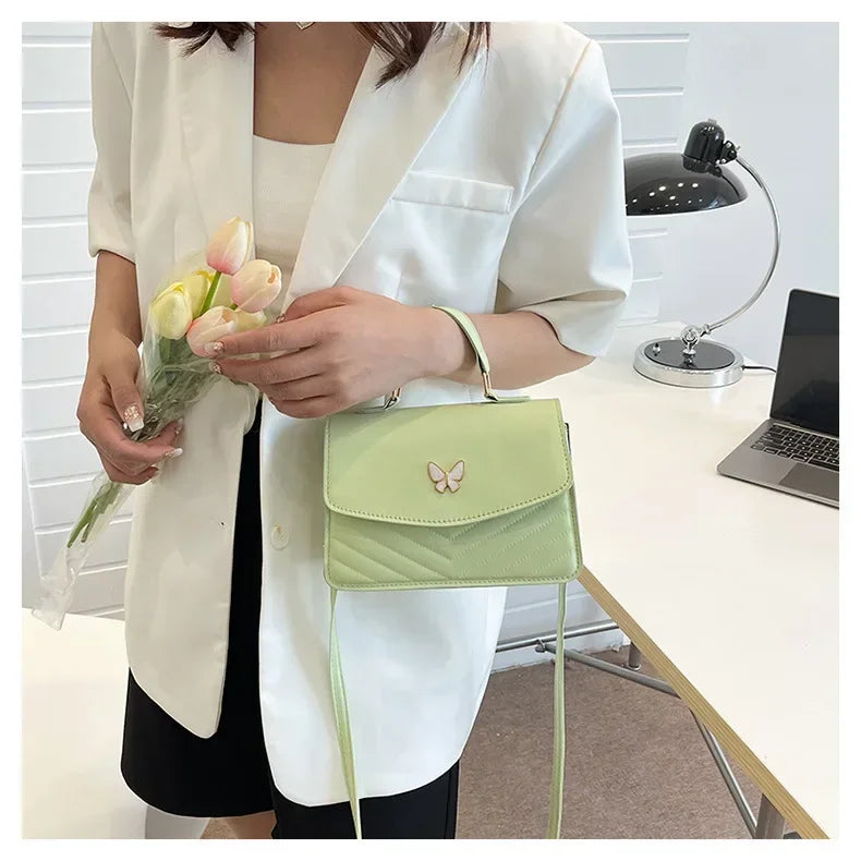 Faux leather bag with butterfly decoration