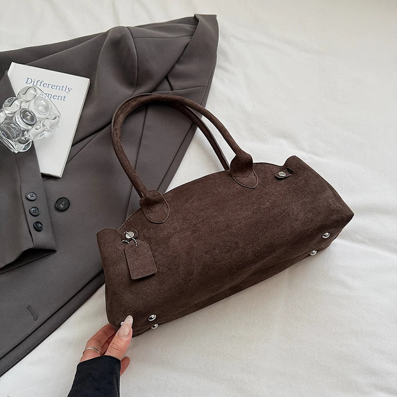 Suede bag with retro design