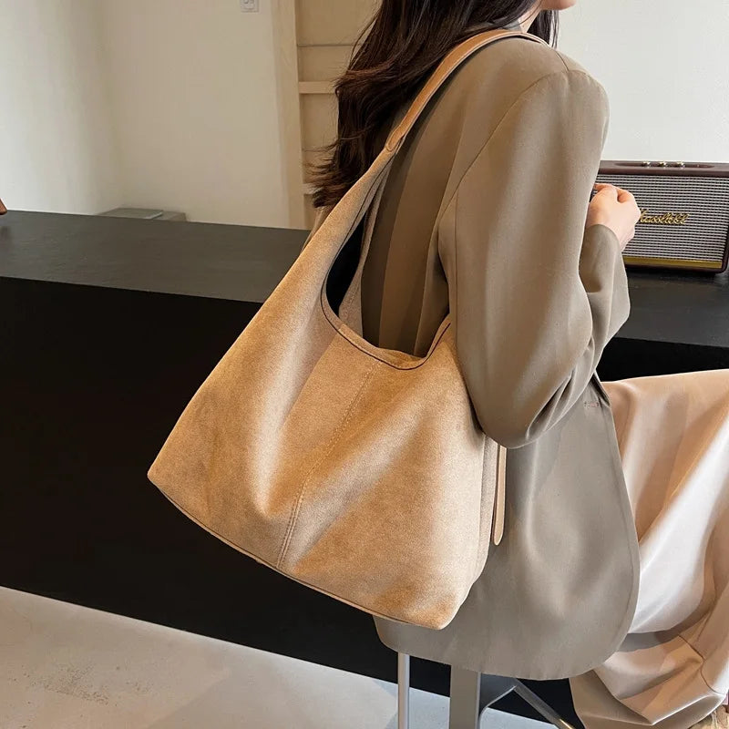 Suede bag with retro design