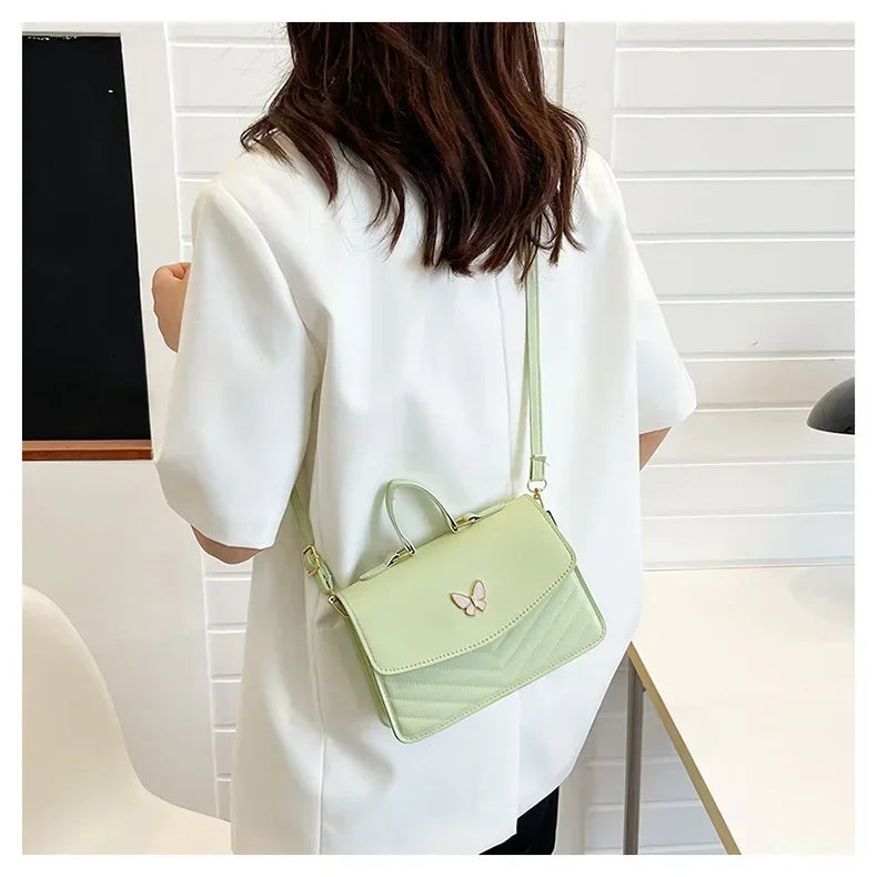 Faux leather bag with butterfly decoration