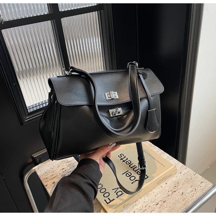 Leather bag with buckle closure