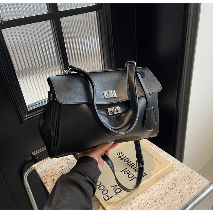 Leather bag with buckle closure