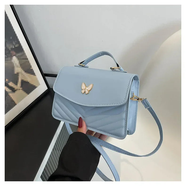 Faux leather bag with butterfly decoration