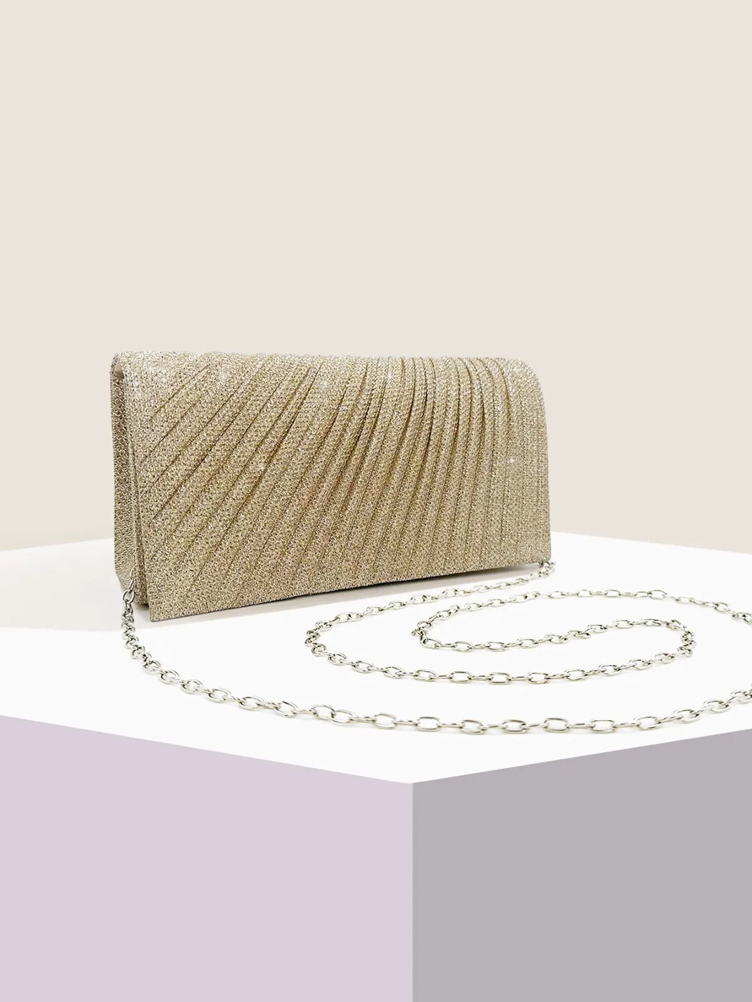 Clutch bag with sparkling studs and chain strap design