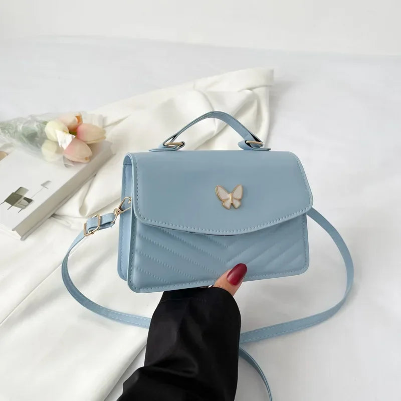 Faux leather bag with butterfly decoration