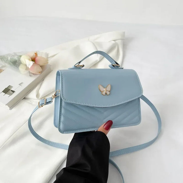 Faux leather bag with butterfly decoration