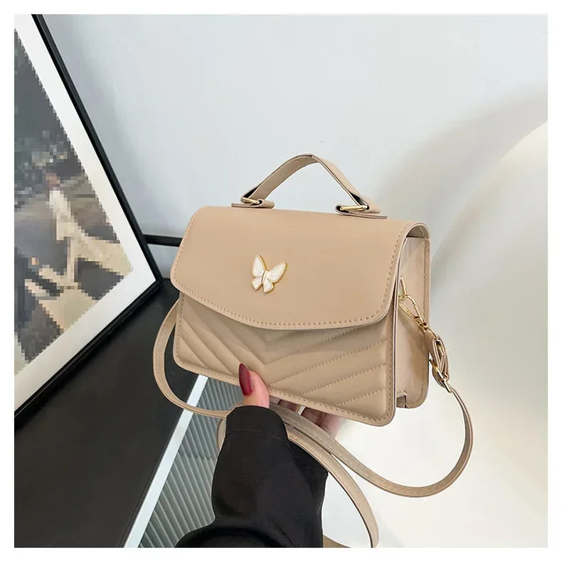 Faux leather bag with butterfly decoration