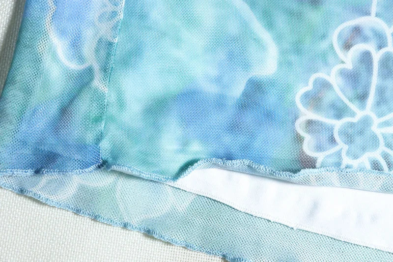 סט שני חלקים בהדפס טרופי טופ וחצאית מקסי מלמלה בעיצוב שסע - MAYA