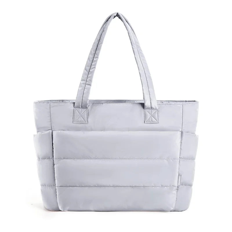 Padded carrying bag with large storage compartment