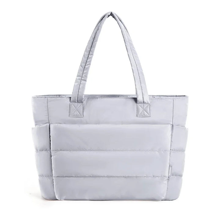 Padded carrying bag with large storage compartment