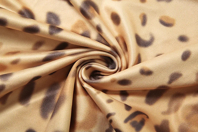 שמלת מקסי מנומרת בעיצוב אסימטרי קשירה בצוואר - רוקסי