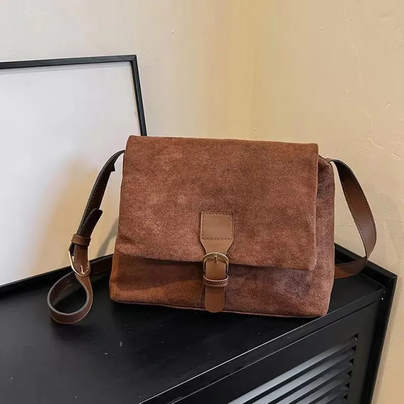 Suede bag with retro design