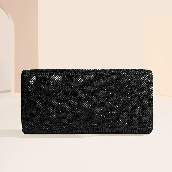 Clutch bag with sparkling studs and chain strap design