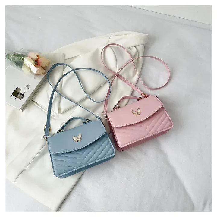 Faux leather bag with butterfly decoration