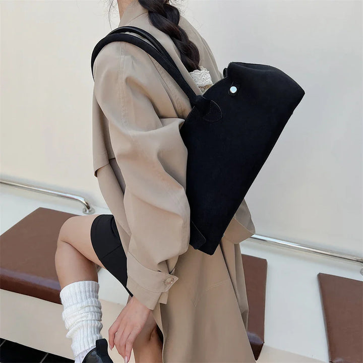 Suede bag with retro design