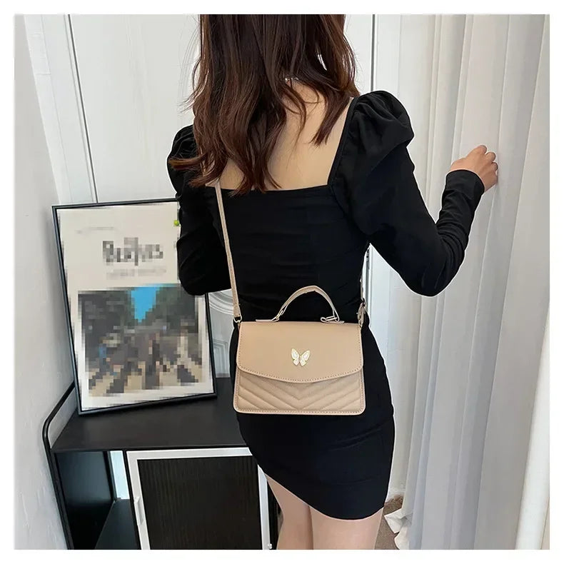 Faux leather bag with butterfly decoration