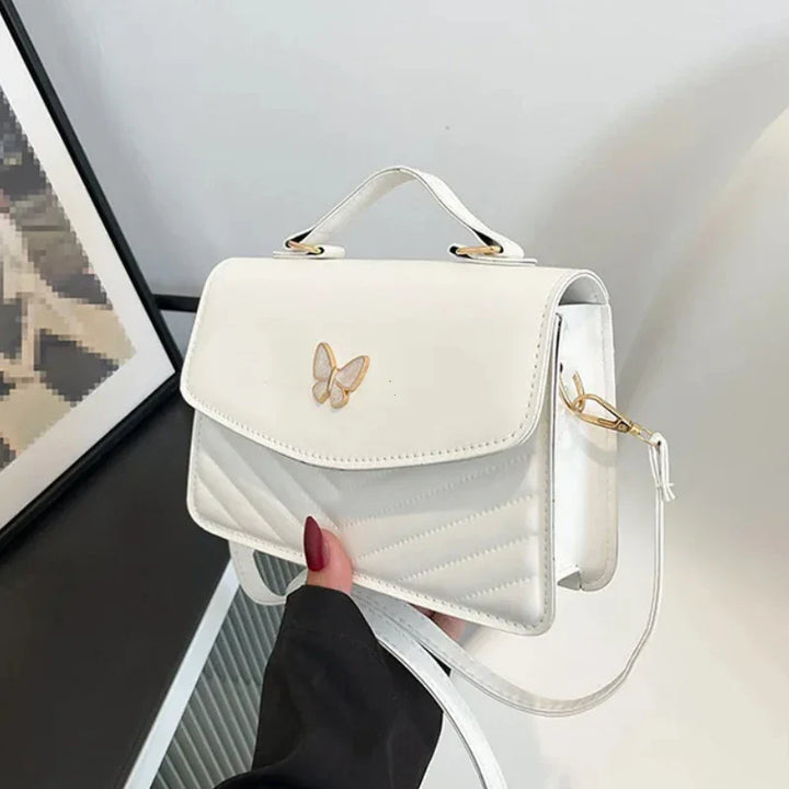 Faux leather bag with butterfly decoration