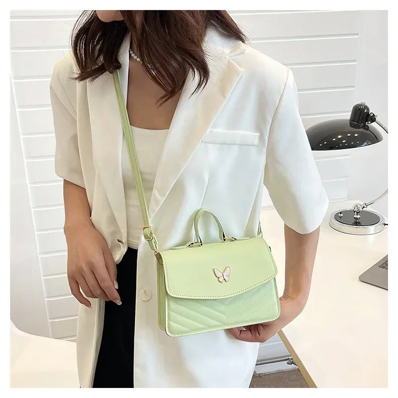 Faux leather bag with butterfly decoration