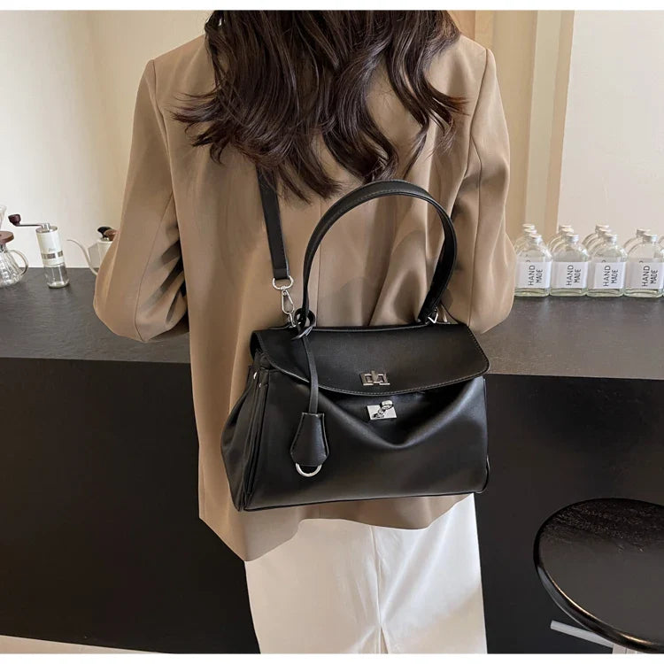 Leather bag with buckle closure