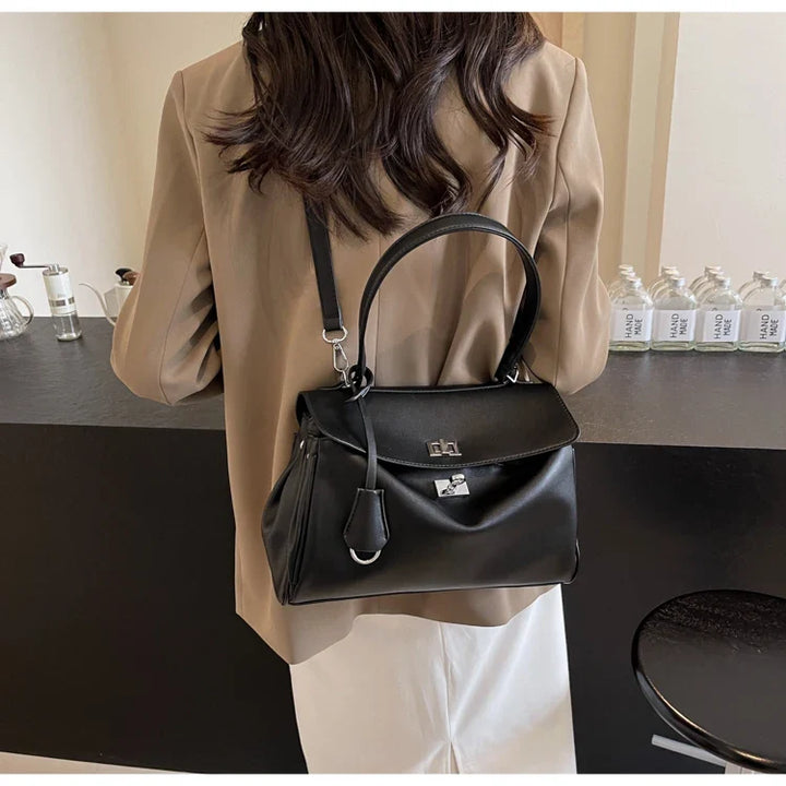 Leather bag with buckle closure