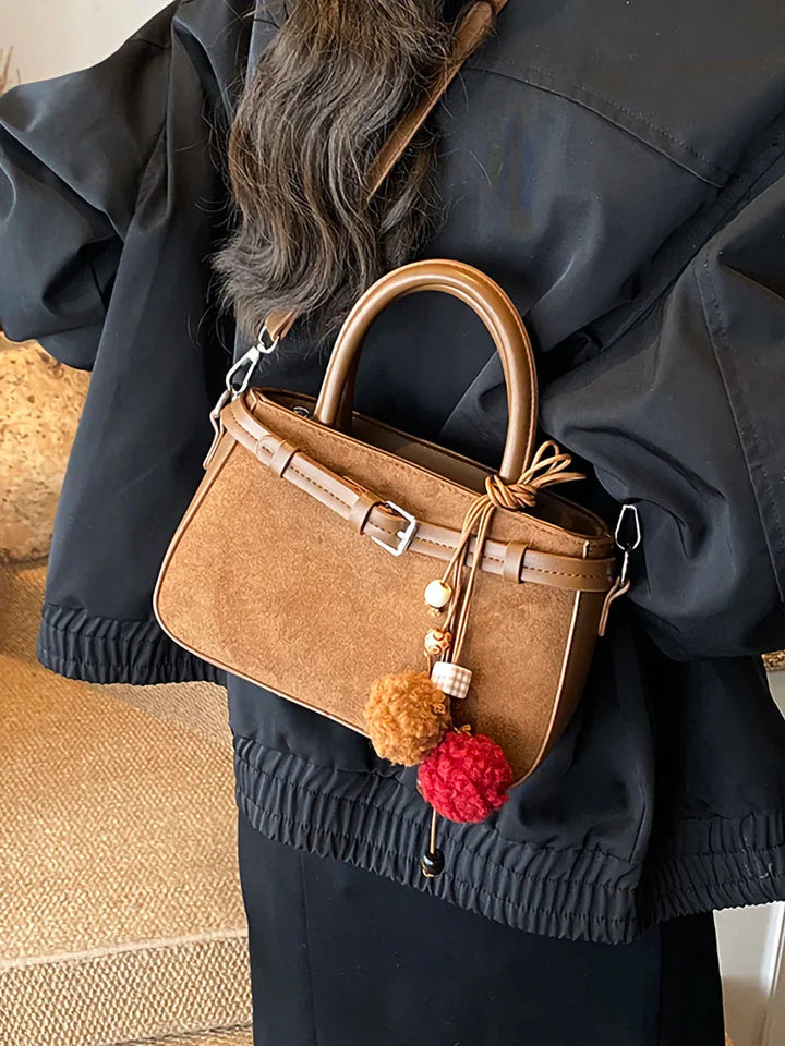 Suede bag with retro design + accessories