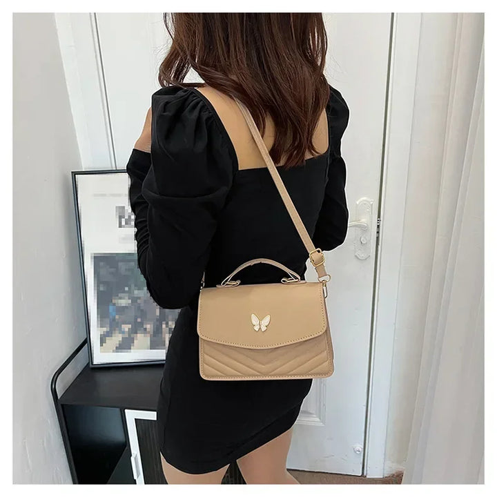 Faux leather bag with butterfly decoration