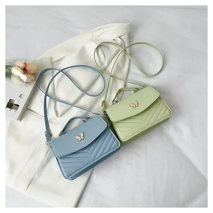 Faux leather bag with butterfly decoration
