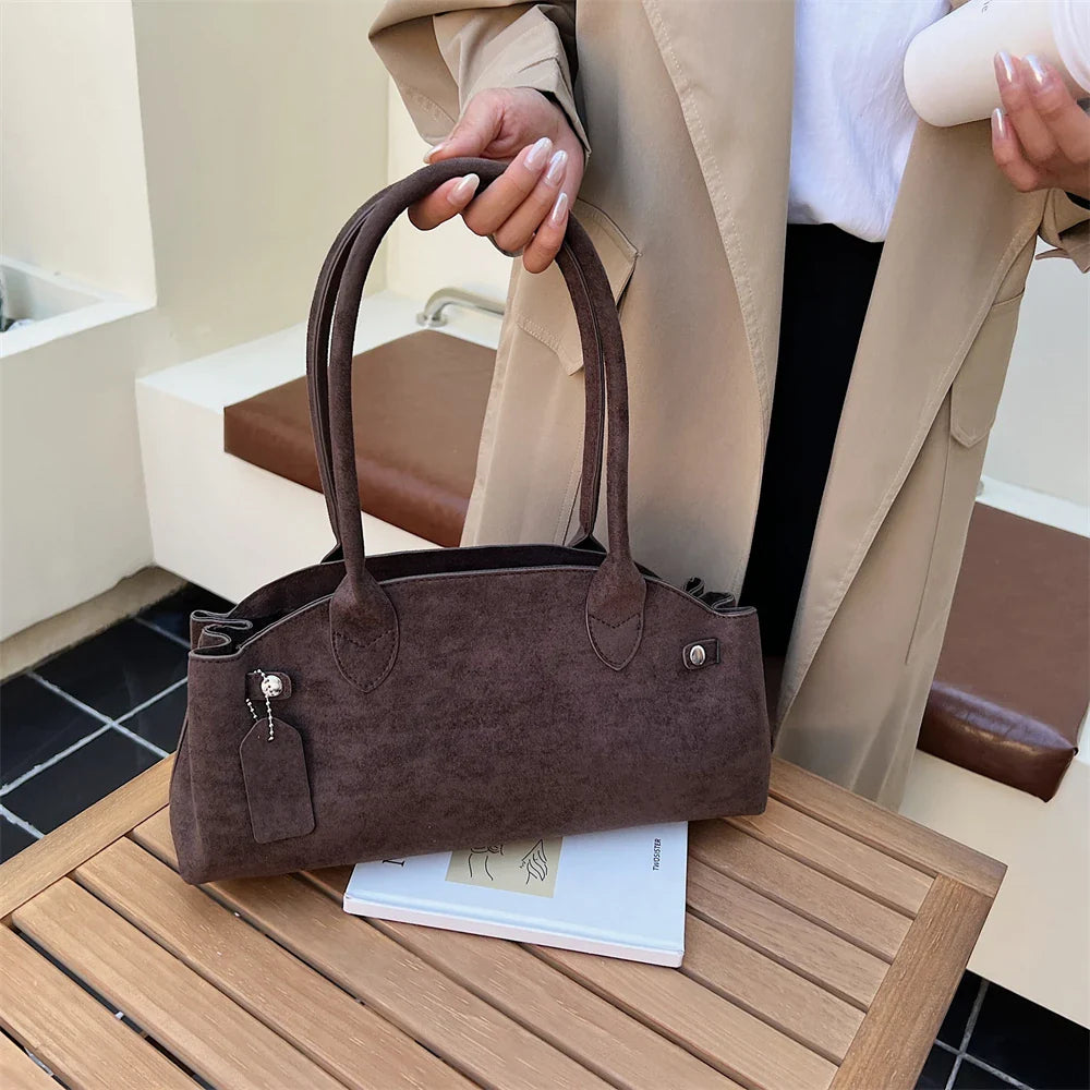 Suede bag with retro design