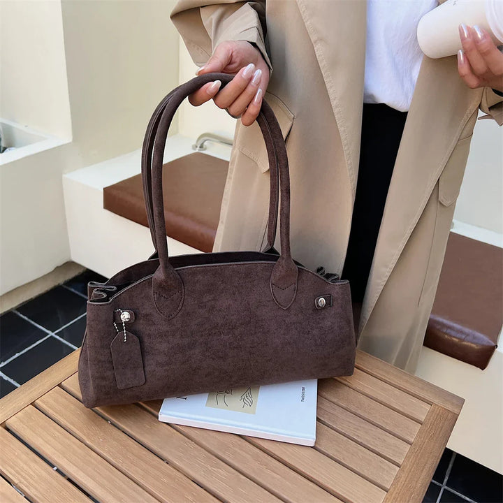 Suede bag with retro design