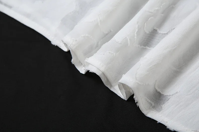 שמלת מיני בגזרת A כתפיות ספגטי בעיטור רקמת עלים ופרחים - שילה