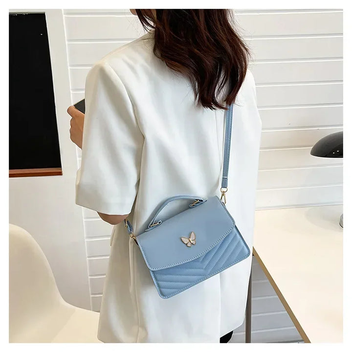Faux leather bag with butterfly decoration