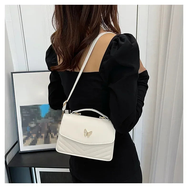 Faux leather bag with butterfly decoration