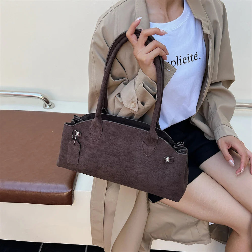 Suede bag with retro design