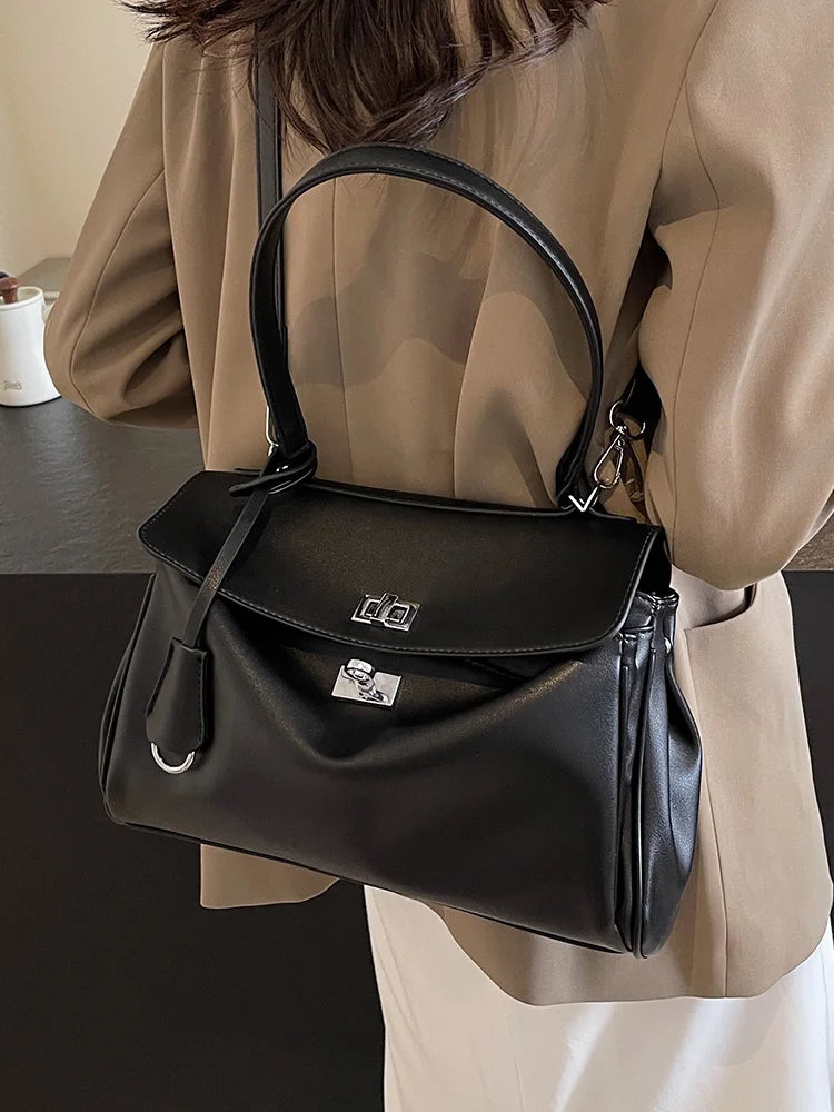 Leather bag with buckle closure