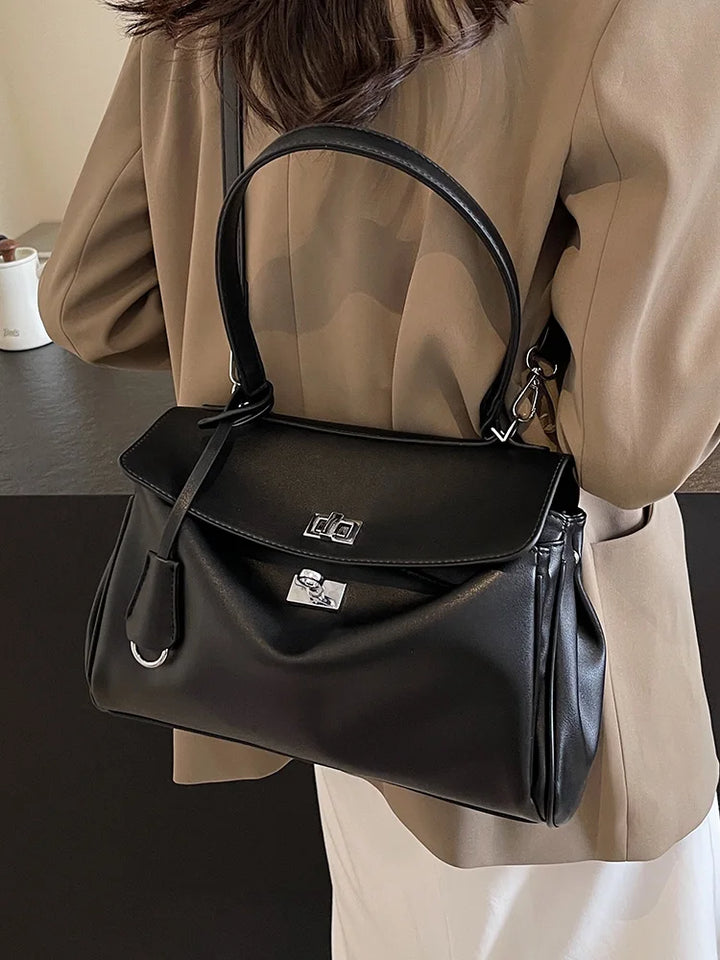 Leather bag with buckle closure