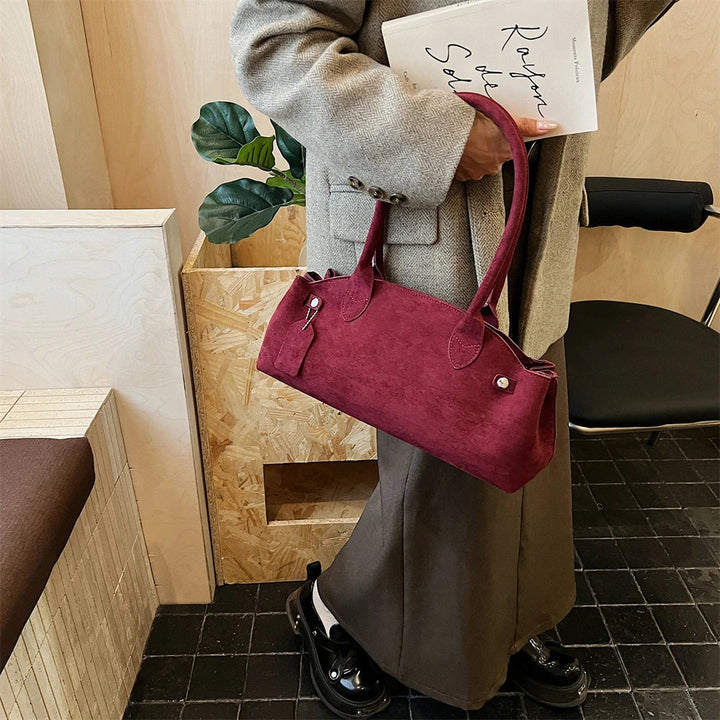 Suede bag with retro design