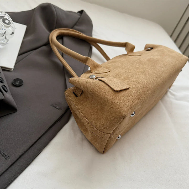 Suede bag with retro design