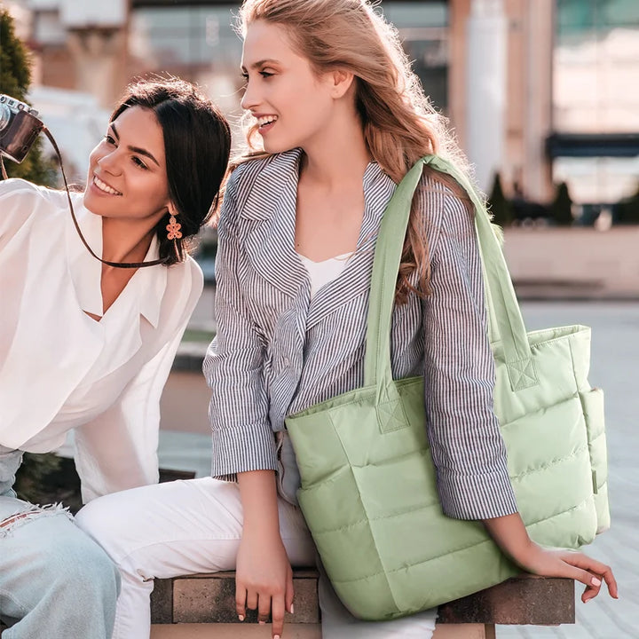 Padded carrying bag with large storage compartment