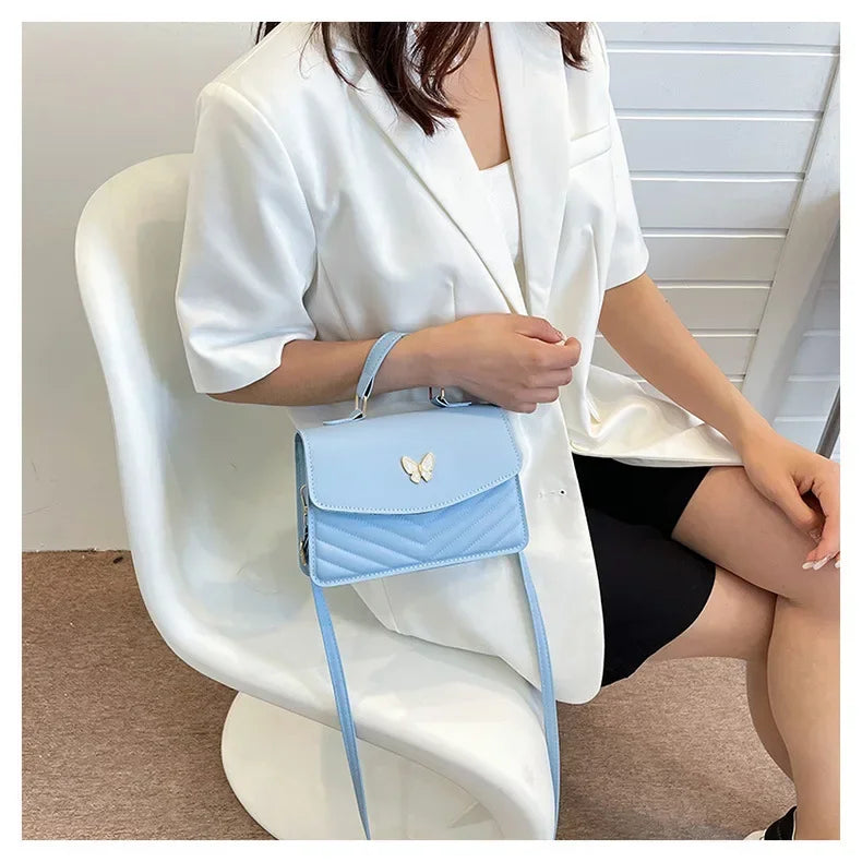 Faux leather bag with butterfly decoration